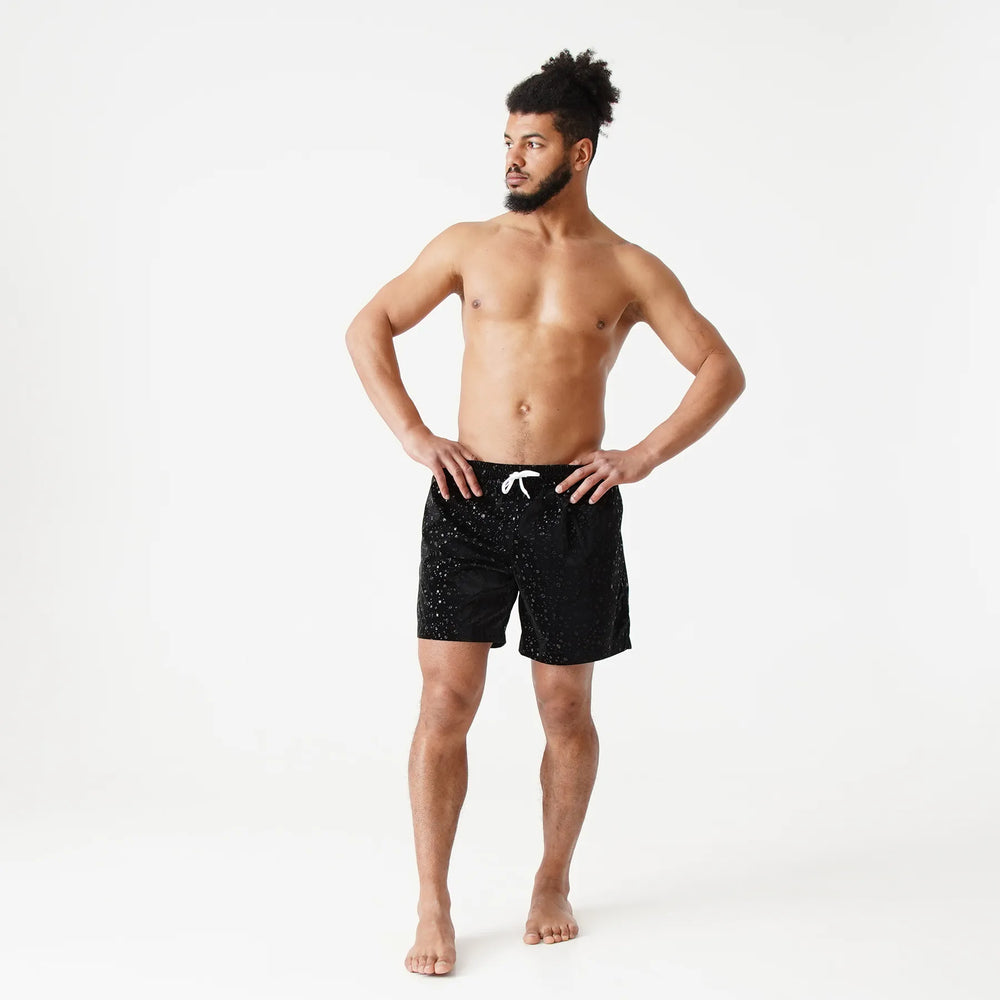 Man’s SET black swim shorts with white drawstring, water drop print, anatomic fit, front view