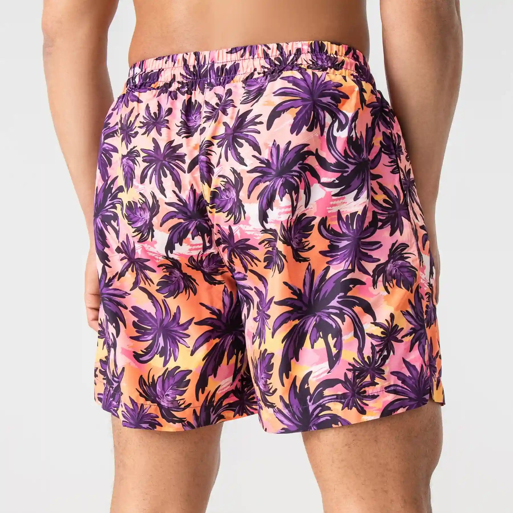 Man’s SET orange swim shorts with purple palm tree print, breathable anatomic swimwear, back view