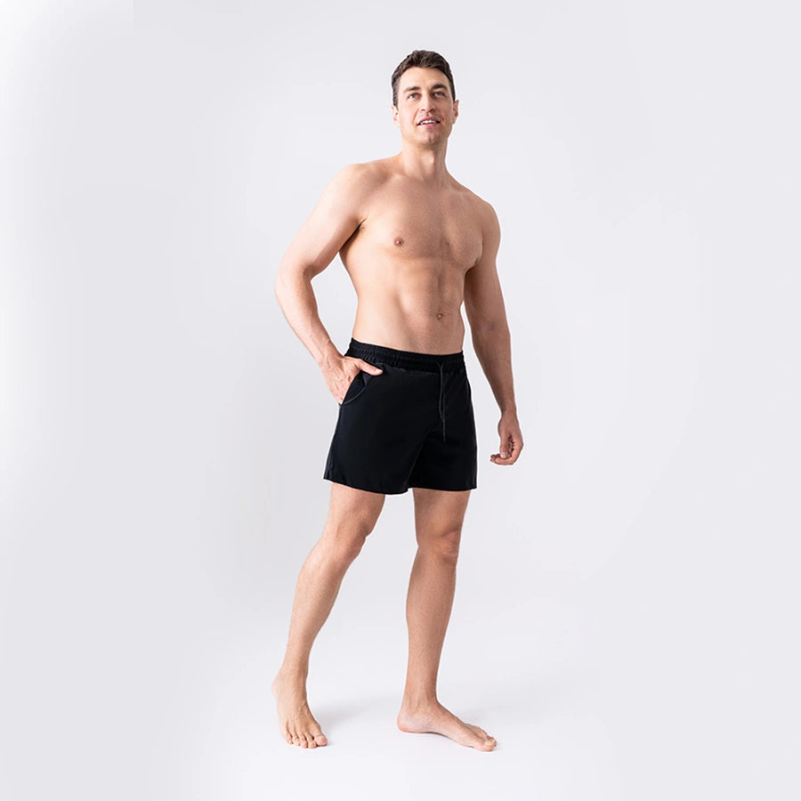 Man’s SET black men’s swim shorts with anatomical pouch lining, breathable quick-dry fabric, front view