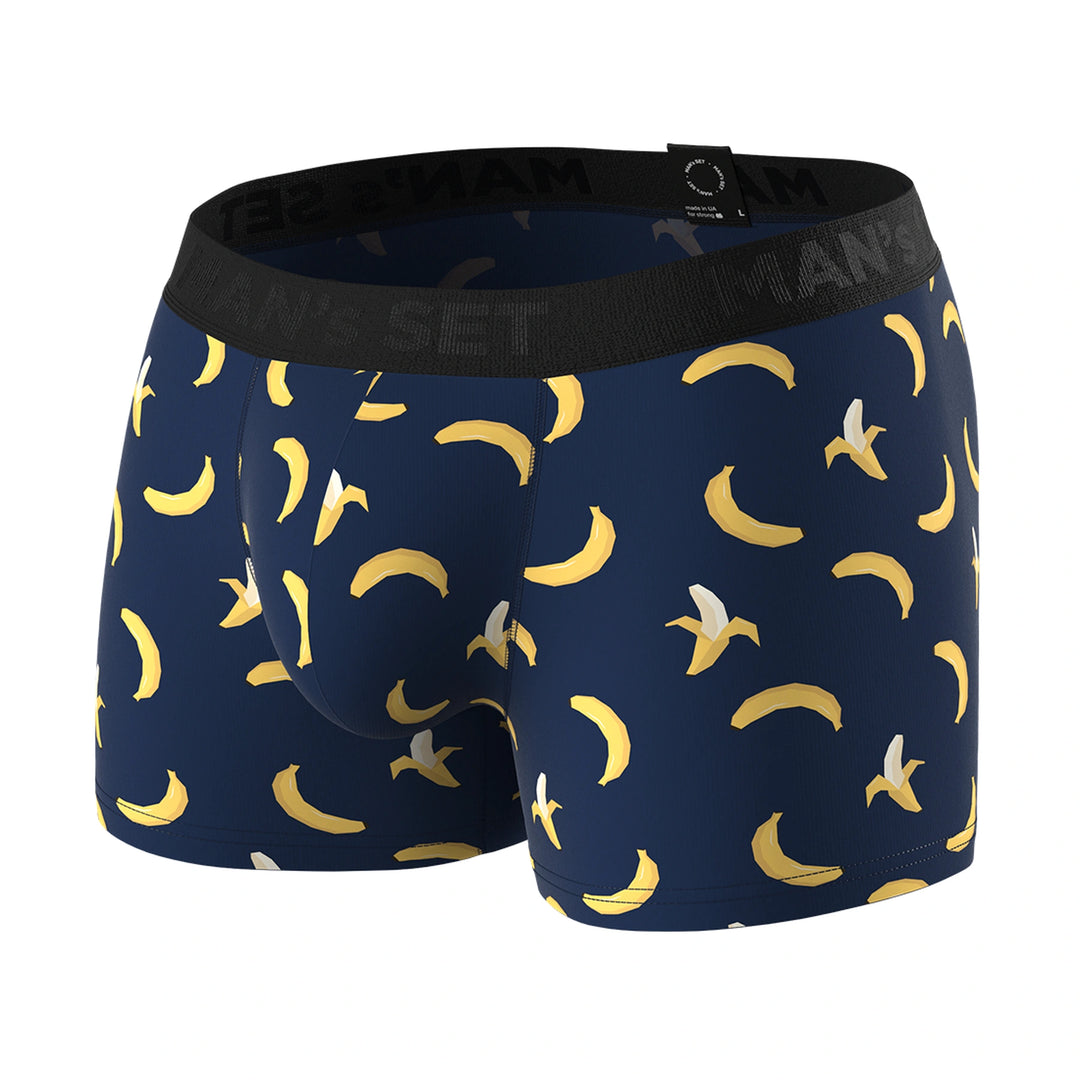 Man’s SET PowerStretch Trunk 3.9" in navy with playful banana print, anatomical men’s underwear, angled front view