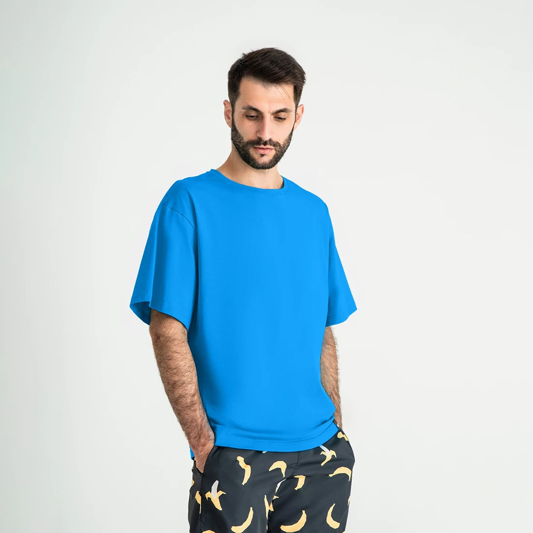 Man’s SET turquoise oversized T-shirt, relaxed fit men’s cotton top, angled front view
