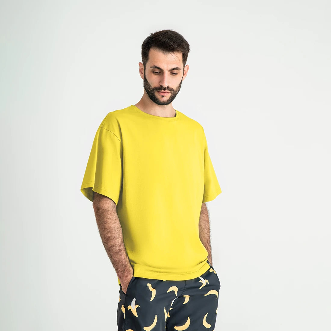 Man’s SET yellow oversized T-shirt, men’s soft cotton style with wide sleeves, angled front view