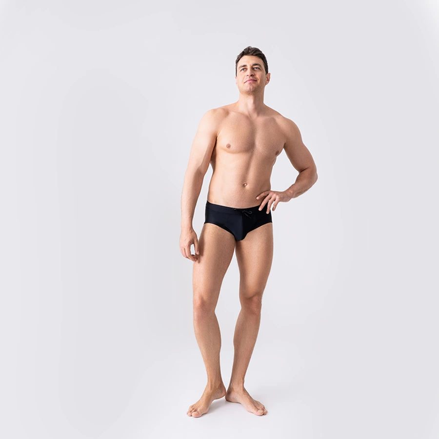 Man’s SET black anatomical men’s swim briefs with drawstring waist, form-fitting swimwear for men, front view