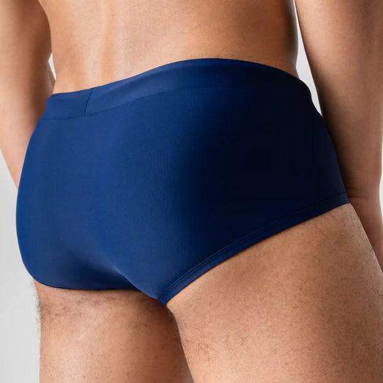 Navy blue anatomical swim briefs by Man’s SET, comfortable men’s swimwear, back view