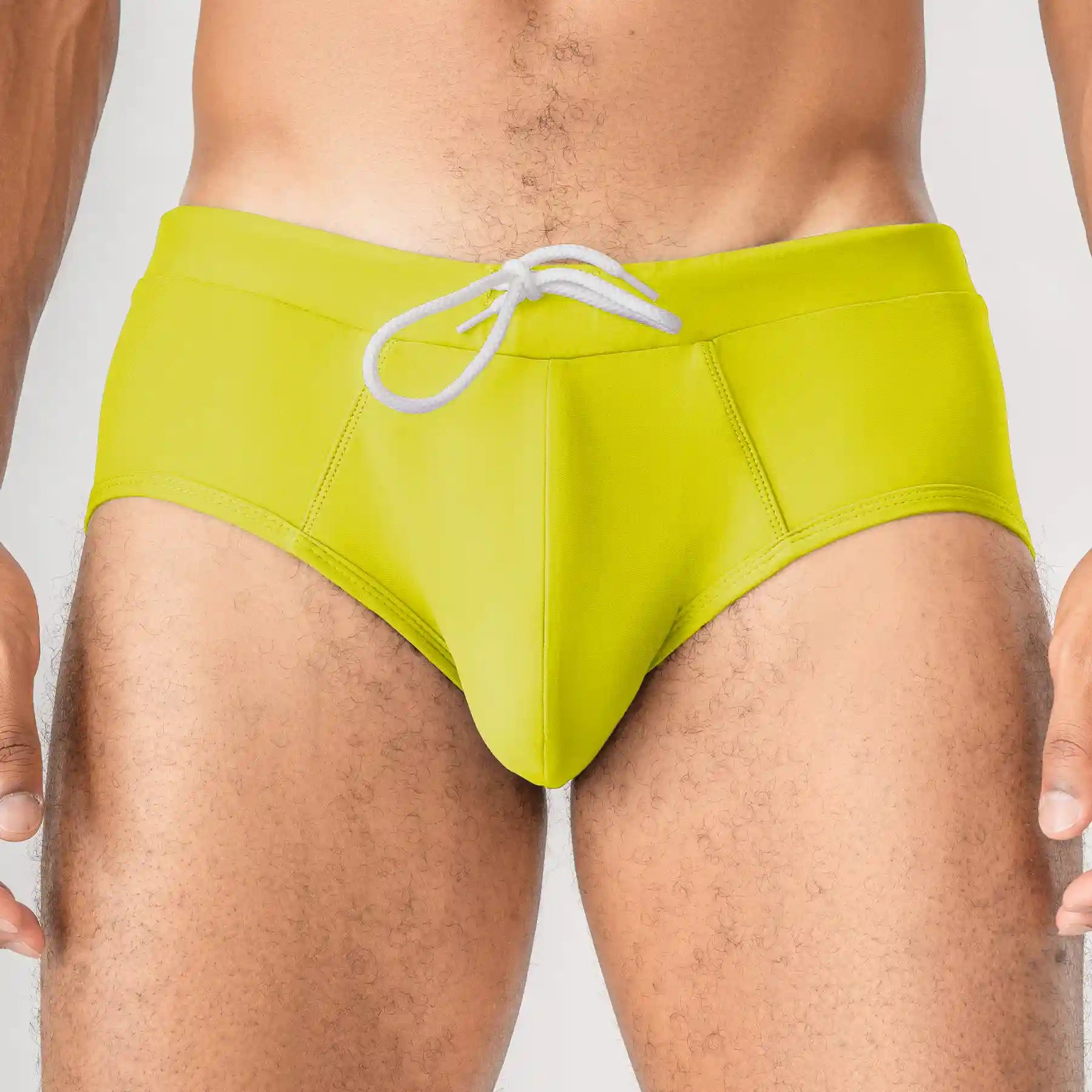 Man’s SET yellow anatomical men’s swim briefs with ergonomic pouch, front close-up view