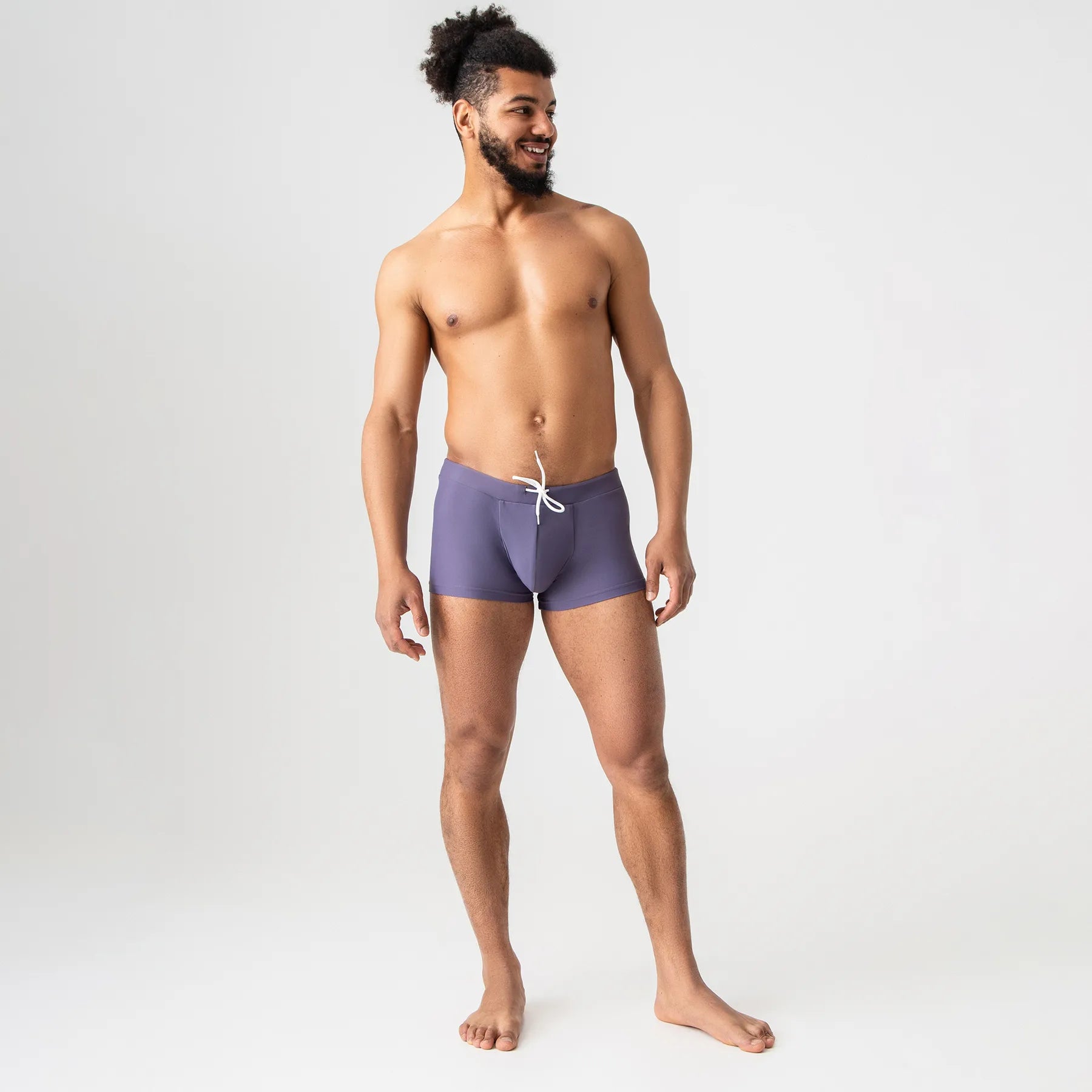 Gray and purple anatomical men’s swim trunks by Man’s SET, supportive fit, front angle view