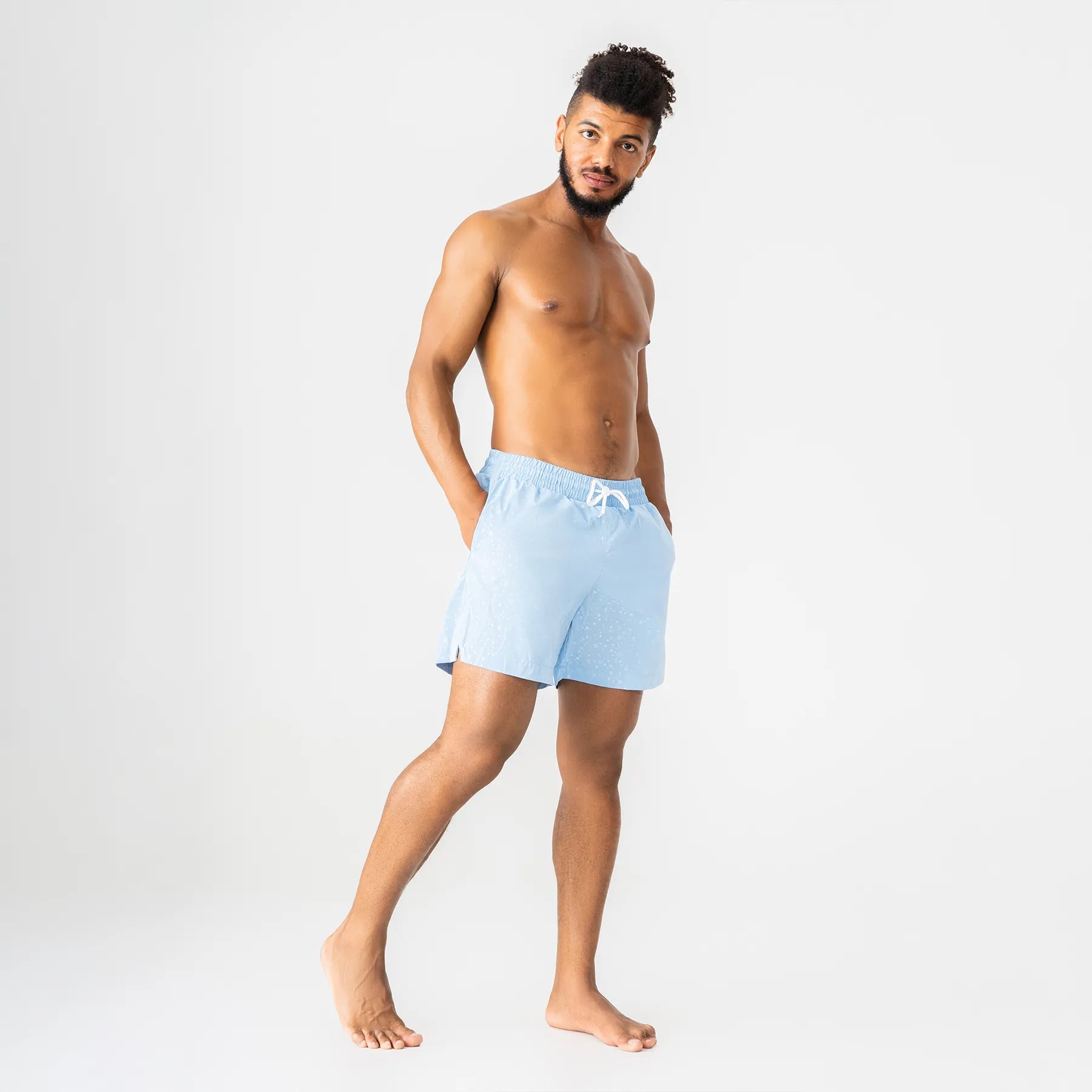 Man’s SET light blue swim shorts with white drawstring, breathable anatomic swimwear, model front view