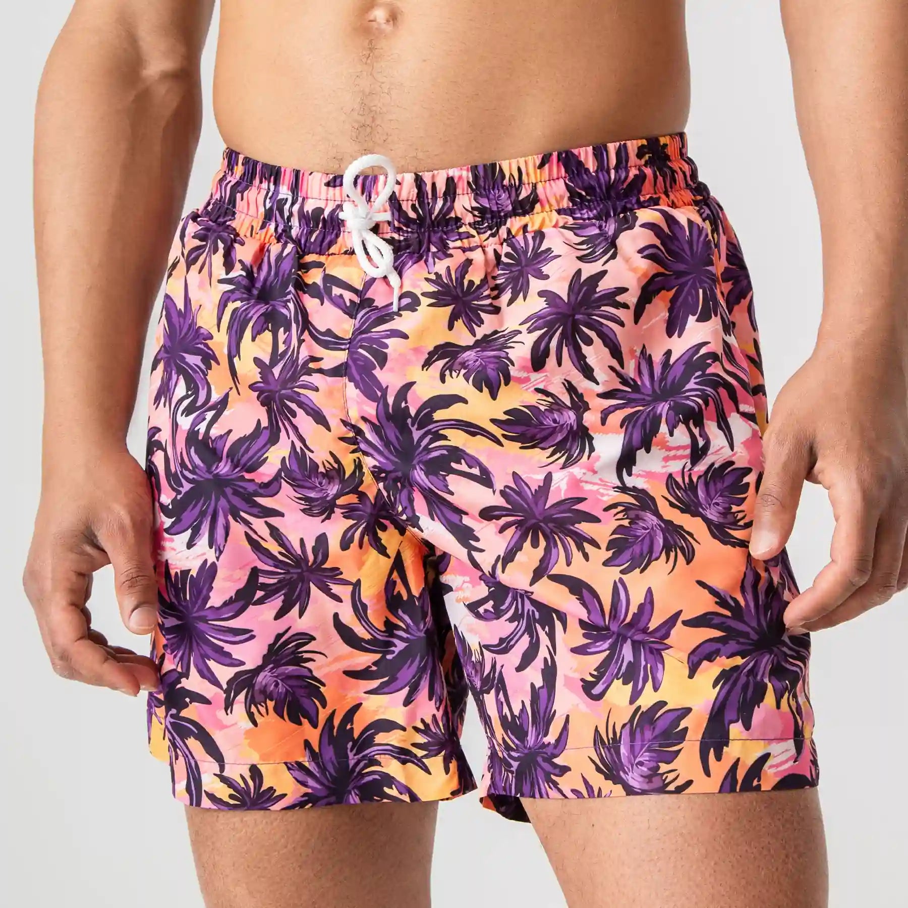 Man’s SET vibrant orange anatomic swim shorts with tropical palm print, lightweight beach swimwear, front view