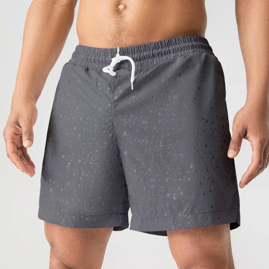 Man’s SET gray swim shorts with white drawstring, water drop print, breathable anatomic swimwear, close-up front view