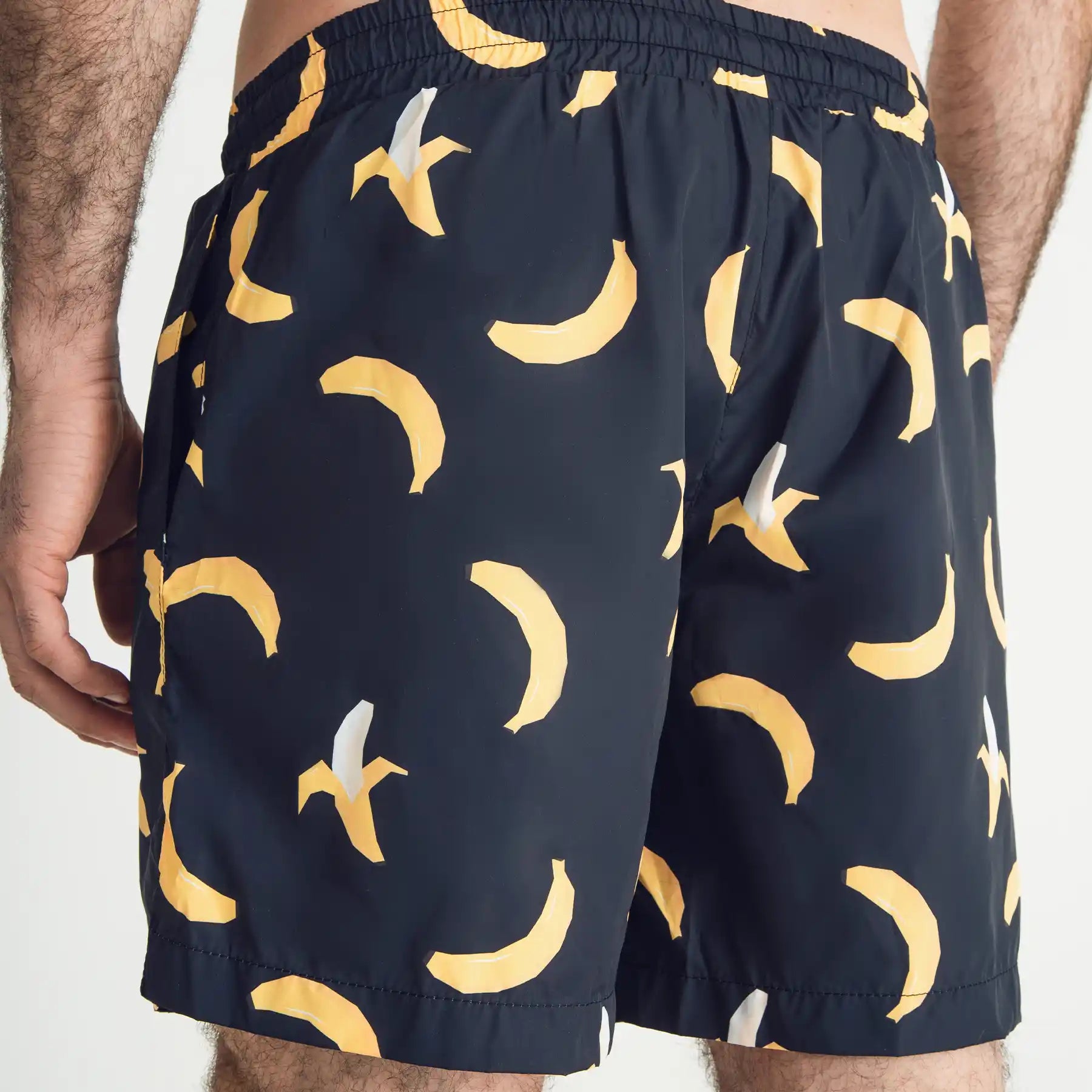 Man’s SET navy swim shorts with yellow banana print, anatomic fit breathable swimwear, back view