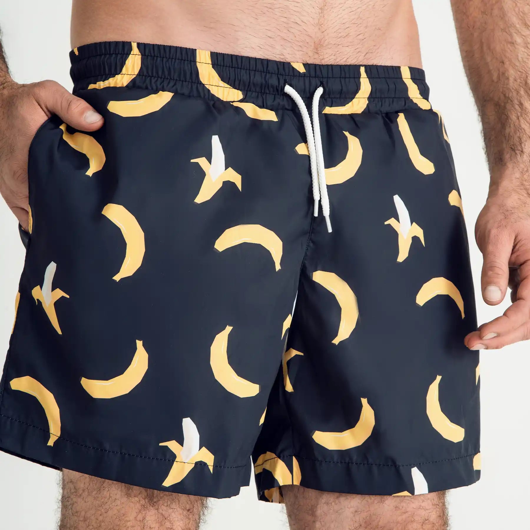 Man’s SET navy swim shorts with yellow banana print, white drawstring, breathable anatomic swimwear, front view