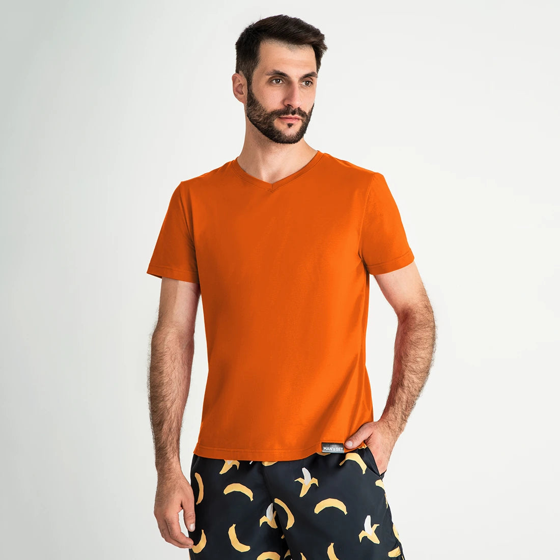 Super-soft V-neck cotton T-shirt in vibrant orange by Man’s SET, lightweight breathable fit, front view