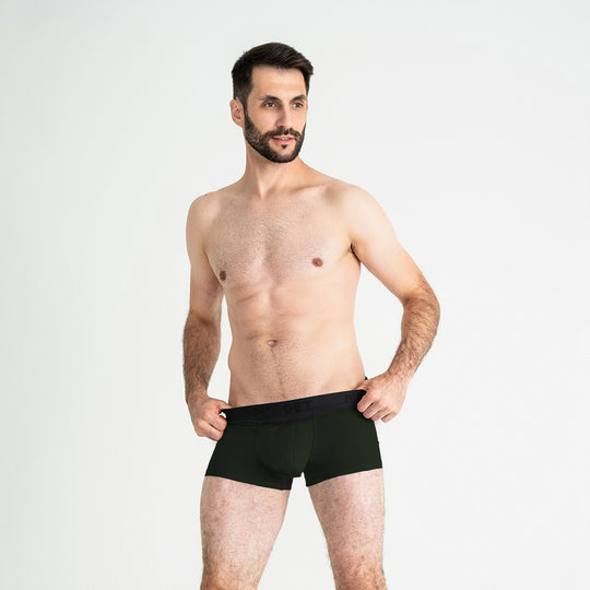 Breathable men’s underwear by Man’s SET, forest green AirFlow Trunk 3.6" with black waistband, front view on model