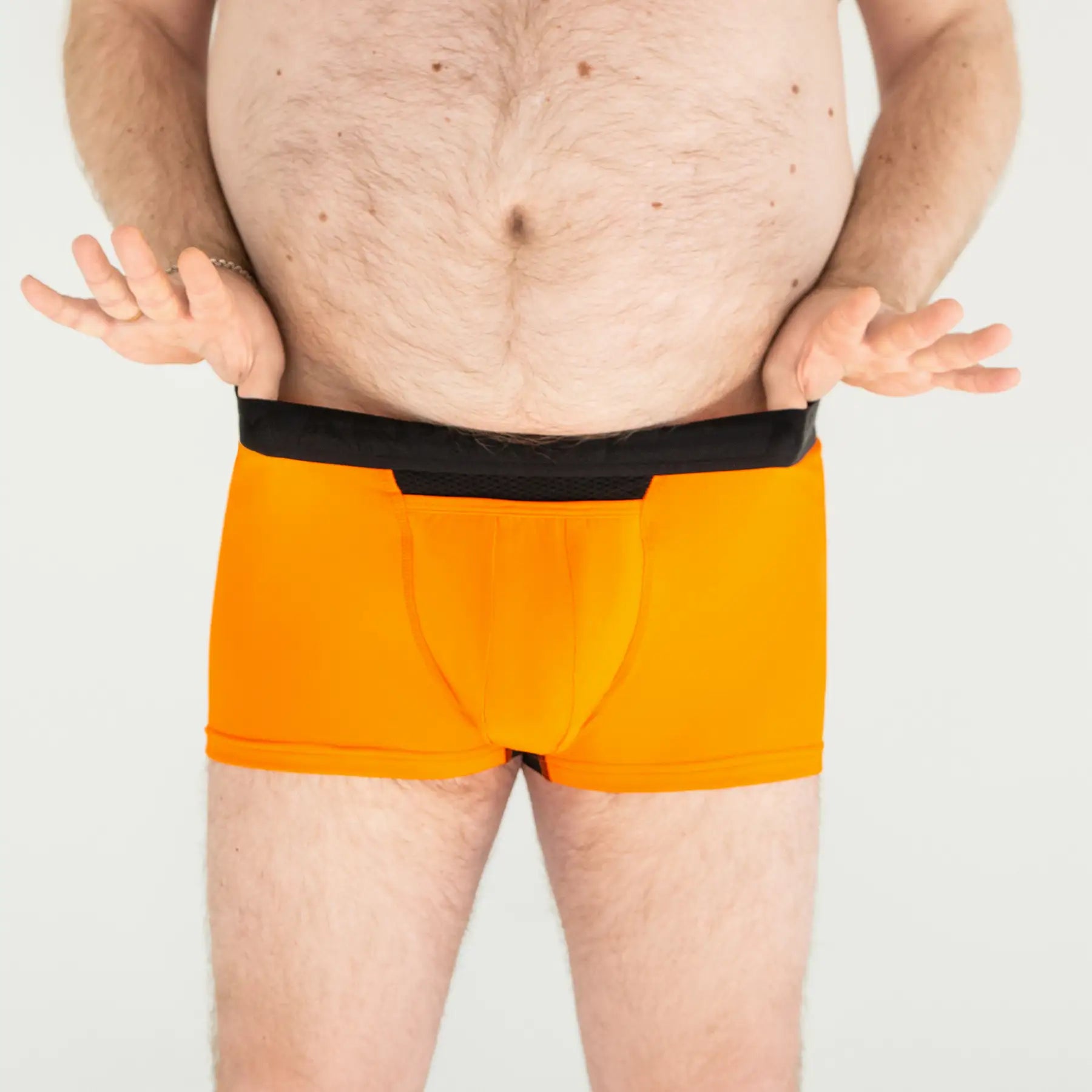 Man’s SET orange anatomical men’s boxer briefs with fly, lightweight breathable plus-size design, front close-up view