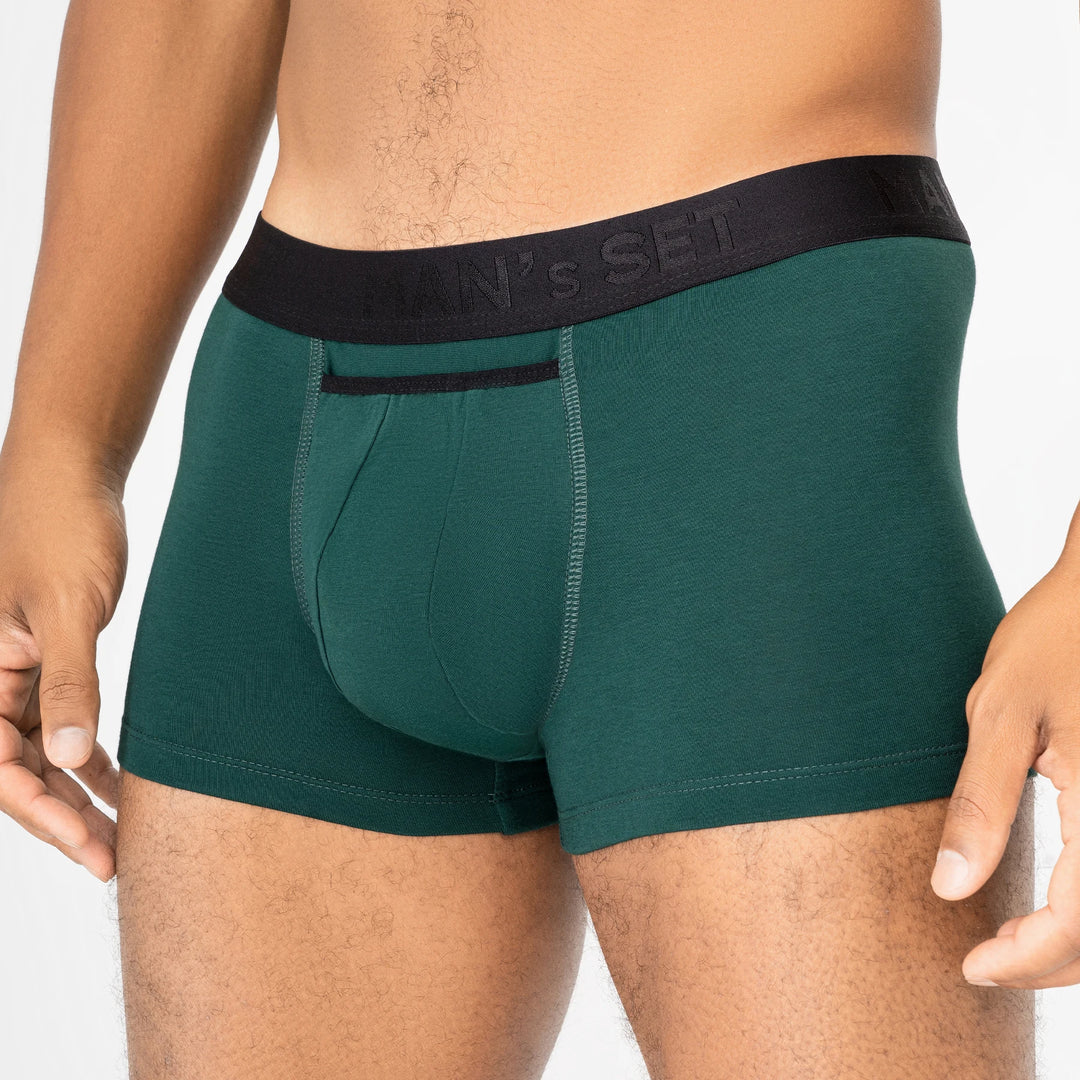 Man’s SET forest green micromodal trunks with black waistband and anatomical open fly, close-up front view