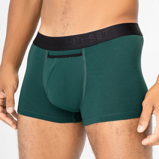Man’s SET forest green micromodal trunks with black waistband and anatomical open fly, close-up front view