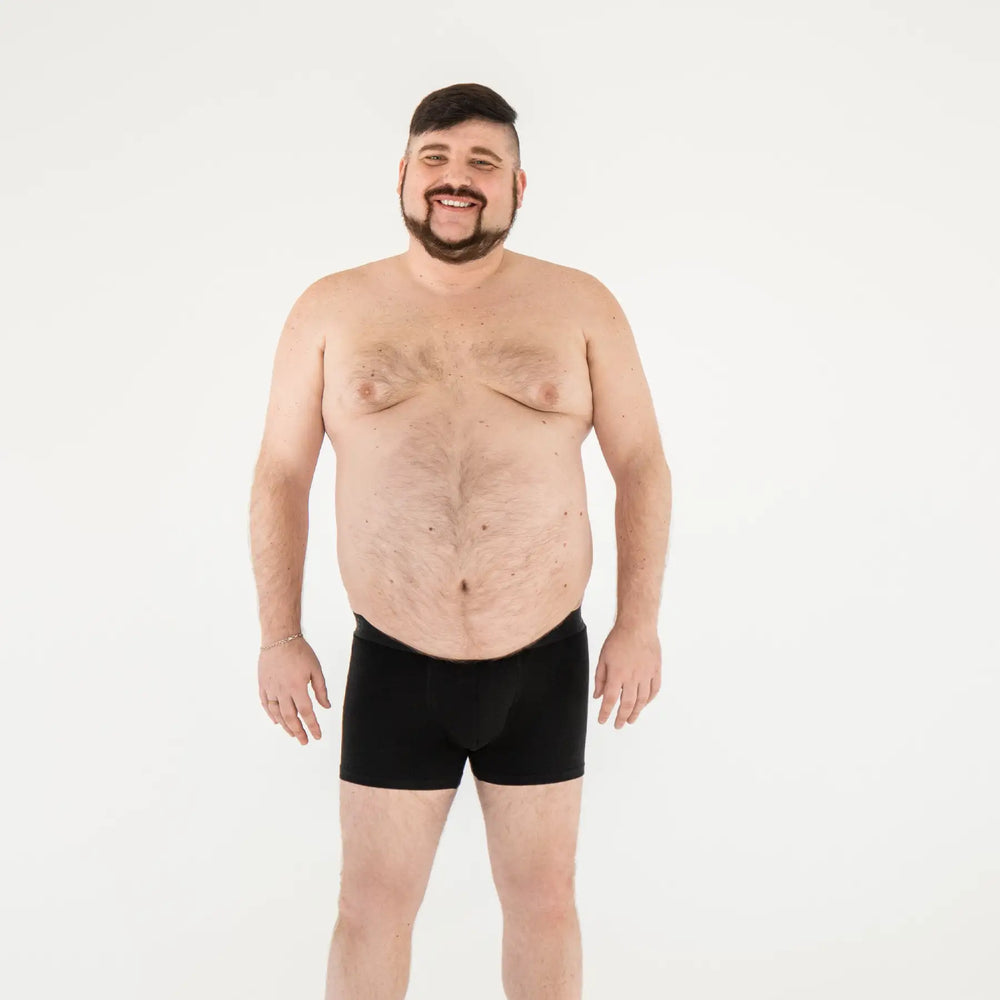 Black plus-size anatomical men’s boxer briefs by Man’s SET, intimate no fly style, full front view