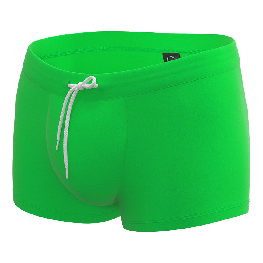 Anatomic Intimate 2.1 green anatomical men’s swim trunks with drawstring waistband, front view
