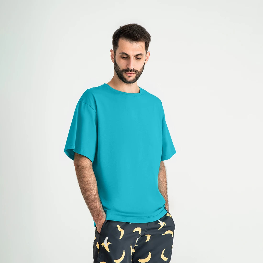 Man’s SET dark mint oversized T-shirt, soft cotton men’s wear, angled front view