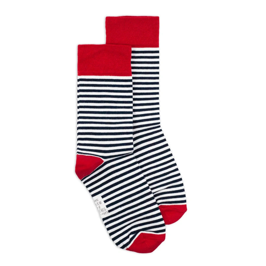 Black and white striped cotton socks by Man’s SET, classic crew style with red heel, toe, and cuff, side view