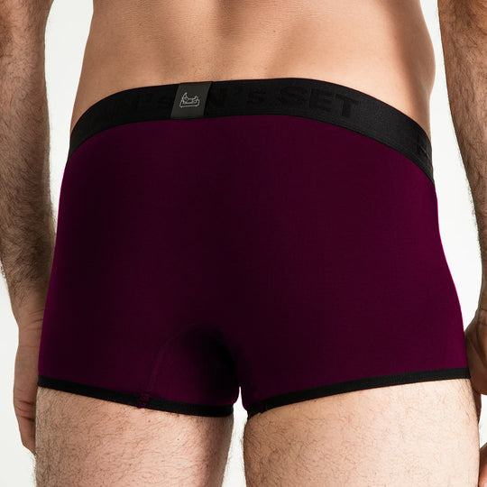Man’s SET ProActive Stretch Trunk in plum, breathable men’s underwear with 3.2" inseam and black waistband, back view