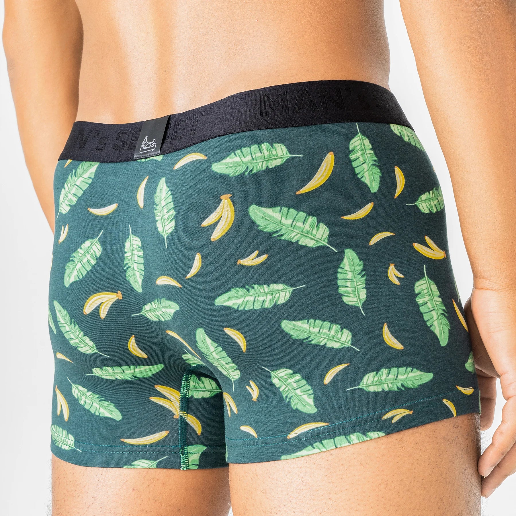 Tropical Vibes men’s underwear by Man’s SET, green PowerStretch trunks with banana leaf print, back view